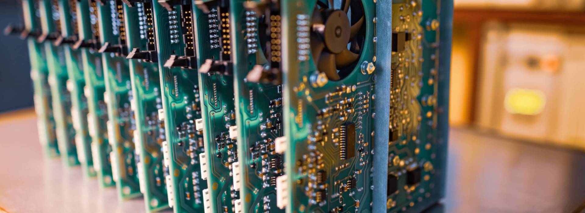 Close-up electric green embedded microcircuits in production Close-up green embedded microcircuits are stacked in box to prepare for the further in factory for production of equipment
